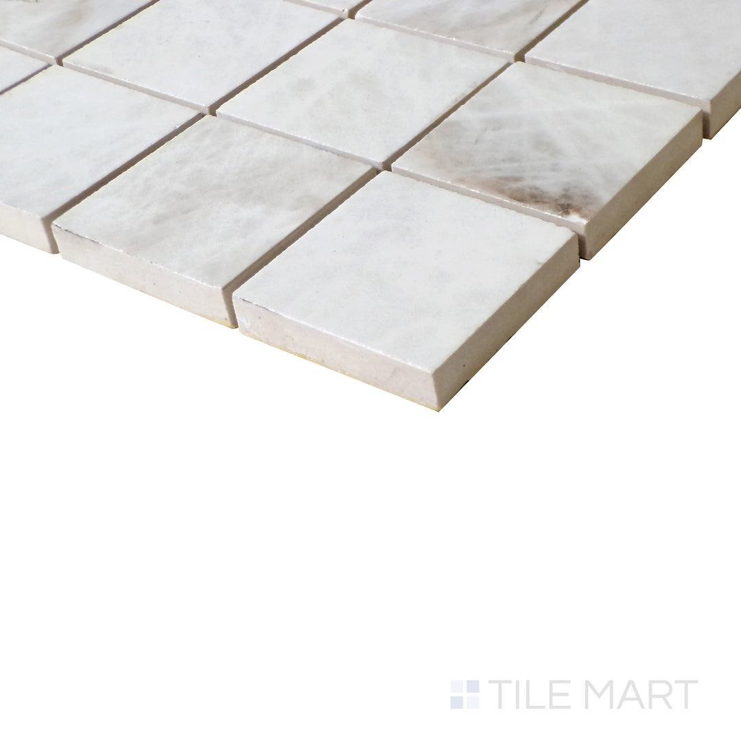 Angled shot of Tele Di Marmo Reloaded Quarzo 2" Square matte porcelain mosaic, featuring a refined quartz-like texture, soft tones, and structured square layout.  