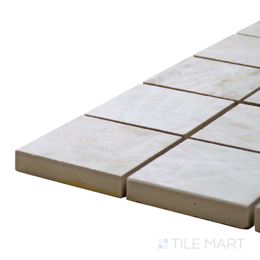 Side perspective of Tele Di Marmo Reloaded Quarzo 2" Square Matte Porcelain Mosaic, capturing its quartz-like soft white tones with a smooth matte finish.