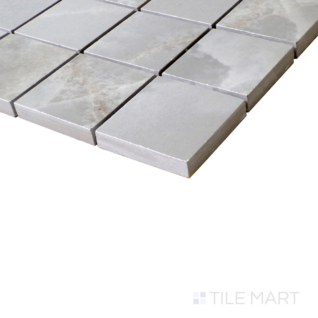 Diagonal view of Tele Di Marmo Reloaded Onice Klmt 2" Square matte porcelain mosaic, showcasing its luxurious onyx-inspired veining, rich color variations, and matte finish.  