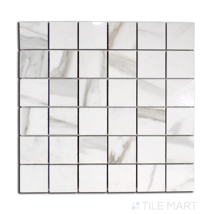 Top-down view of Tele Di Marmo Reloaded Calacatta 2" square polished porcelain mosaic, boasting a glossy finish with refined marble-like veining.