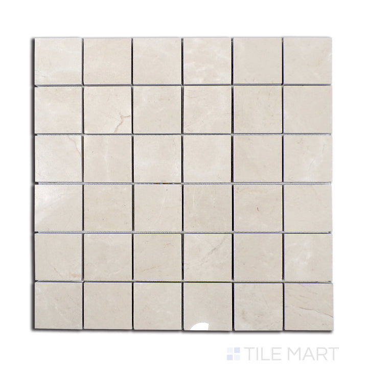 Overhead shot of Tele Di Marmo Reloaded Marfil 2" square polished porcelain mosaic, a luminous beige tile with a radiant polished texture.