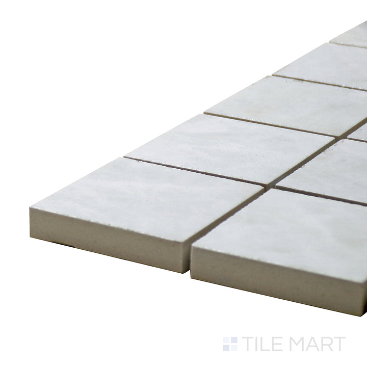 Corner angle of Tele Di Marmo Reloaded Quarzo 2" Square Polished Porcelain Mosaic, emphasizing its bright white quartz-like texture with a glossy surface.