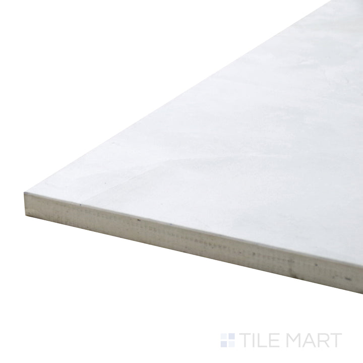 Angled view of Tele Di Marmo Revolution Thassos 24X48 Matte Porcelain Tile, showcasing its crisp white tones and subtle marble-like texture in a refined matte surface.