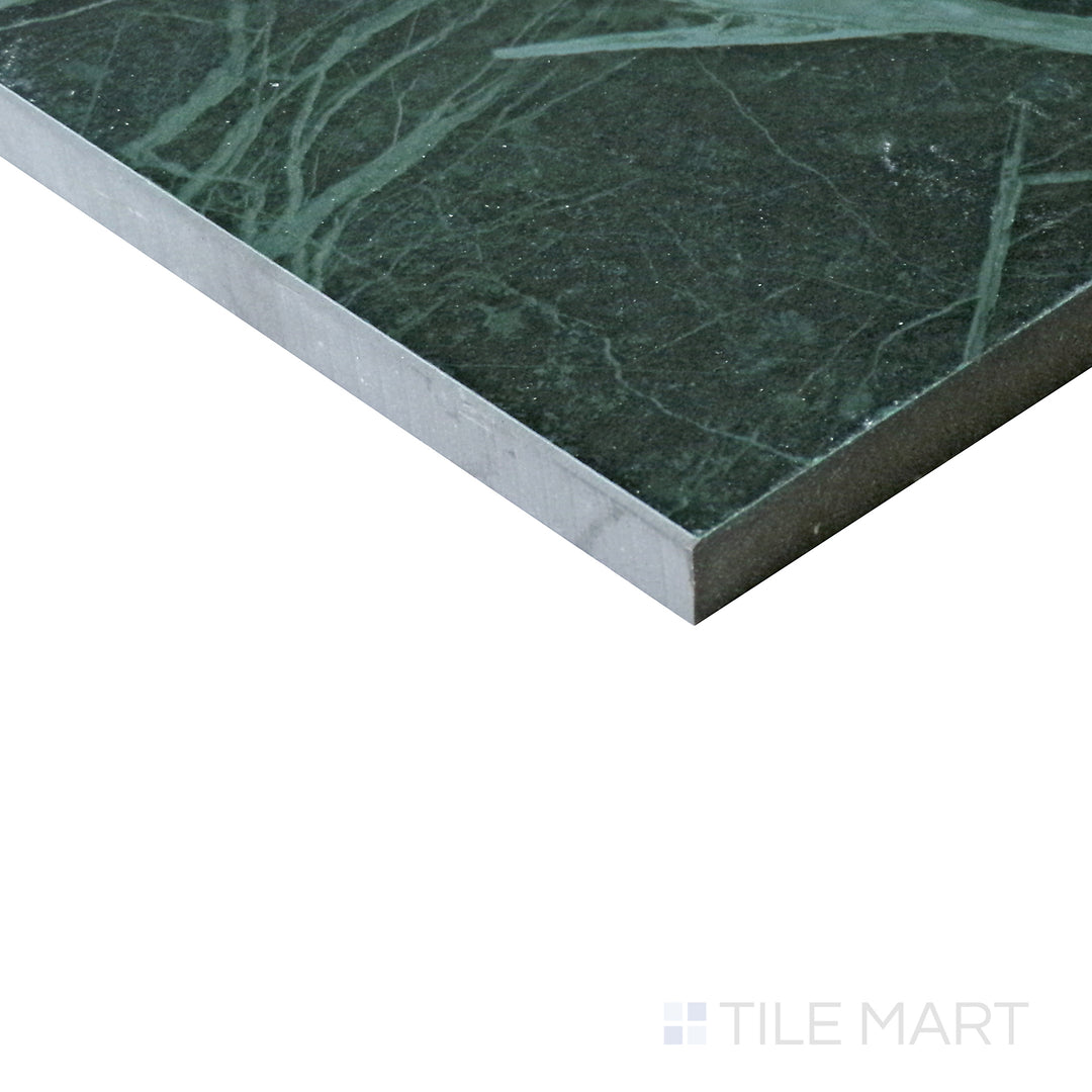 Angled view of Tele Di Marmo Revolution Verde St Denis 24x48 matte porcelain tile, showcasing its deep green tones, refined veining, and luxurious matte finish.  