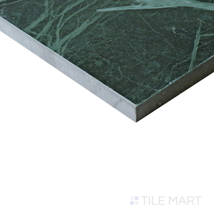 Angled view of Tele Di Marmo Revolution Verde St Denis 24x48 matte porcelain tile, showcasing its deep green tones, refined veining, and luxurious matte finish.  