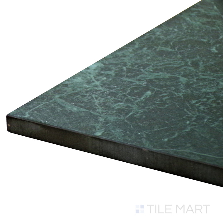 Close-up corner shot of Tele Di Marmo Revolution Verde St Denis 24X48 Matte Porcelain Tile, highlighting its rich green hues with natural veining and a soft matte finish.