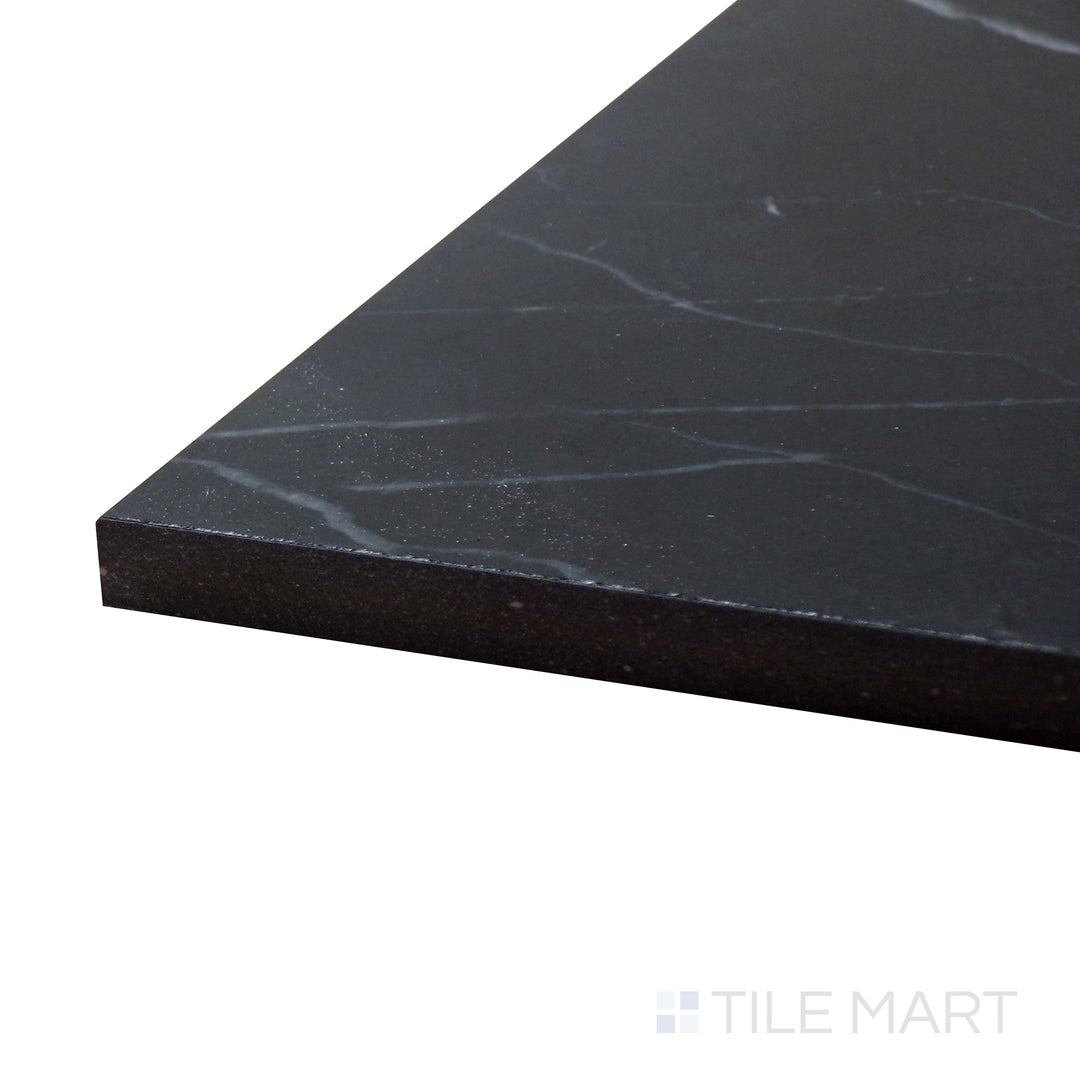 Corner angle of Tele Di Marmo Revolution Calacatta Black 24X48 Polished Porcelain Tile, emphasizing its deep black marble-inspired surface with bold white veining.