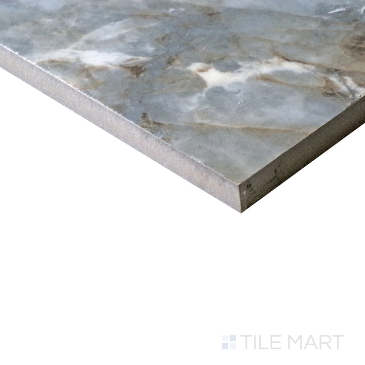 Slanted perspective of Tele Di Marmo Revolution Patagonia 24x48 polished porcelain tile, emphasizing its unique blend of earthy tones, bold veining, and a reflective polished finish.  