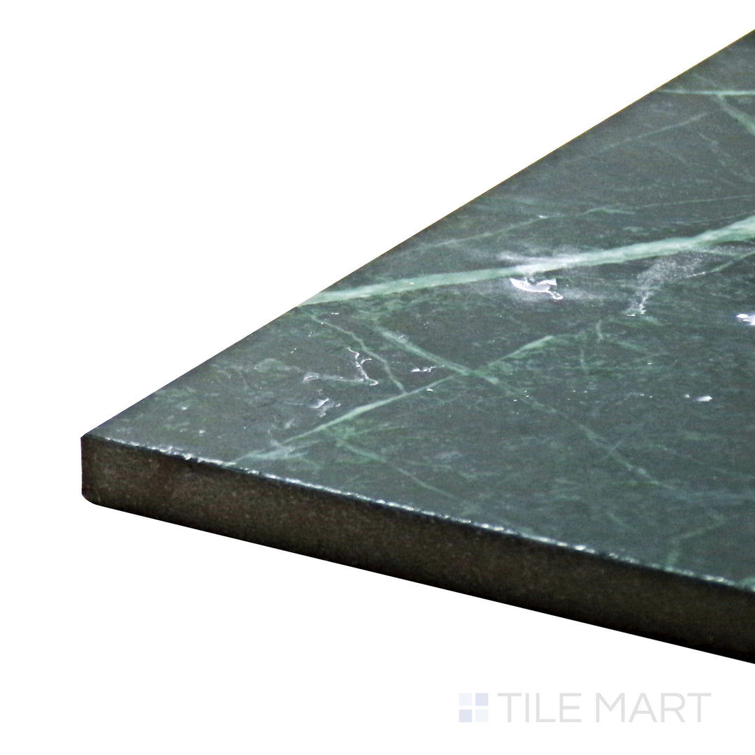 Corner-focused shot of Tele Di Marmo Revolution Verde St Denis 24X48 Polished Porcelain Tile, showcasing its luxurious green tones with intricate veining in a polished finish.