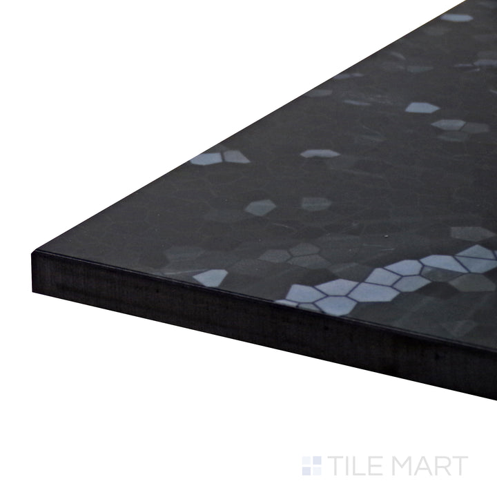 Corner shot of Tele Di Marmo Revolution Calacatta Black 24X48 Polished Porcelain Tile, showcasing its bold black marble design with striking white veining and a high-gloss finish.