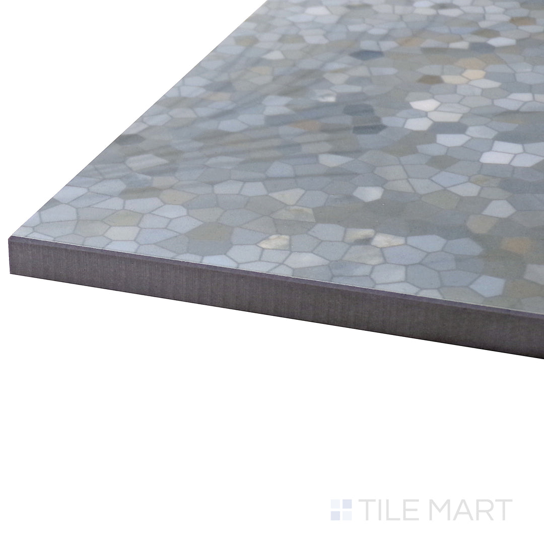 Angled view of Tele Di Marmo Revolution Patagonia 24X48 Polished Porcelain Tile, highlighting its intricate natural stone patterns and glossy surface for a high-end look.