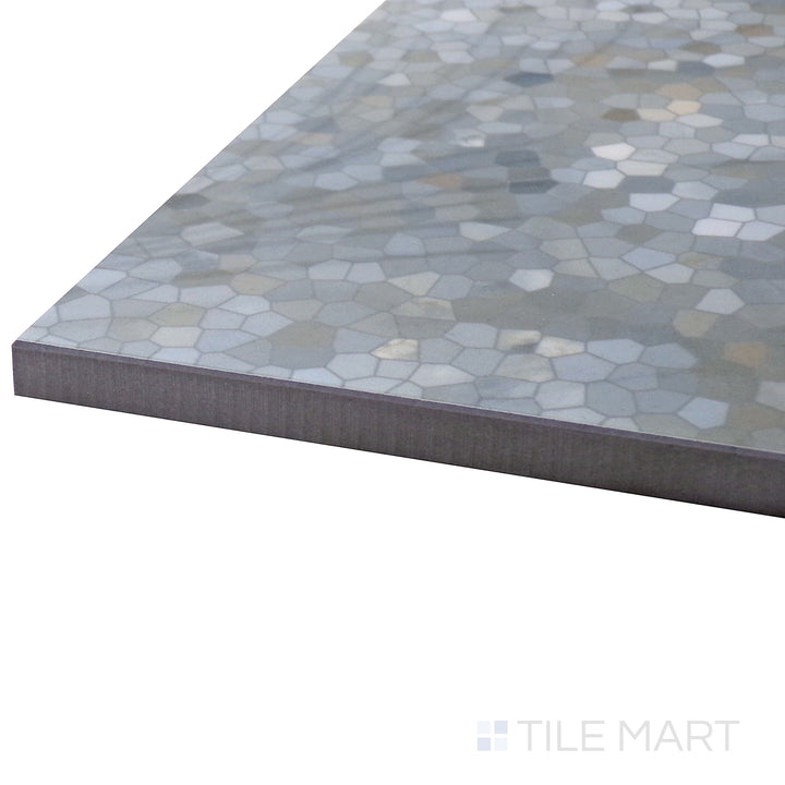 Angled view of Tele Di Marmo Revolution Patagonia 24X48 Polished Porcelain Tile, highlighting its intricate natural stone patterns and glossy surface for a high-end look.