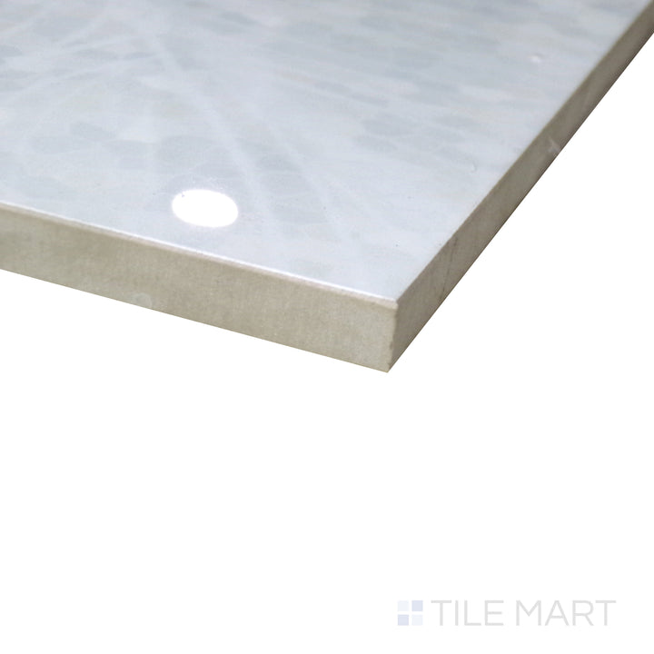 Diagonal shot of Tele Di Marmo Revolution Thassos 24x48 polished porcelain tile, capturing its clean white finish, smooth texture, and large-format elegance.  