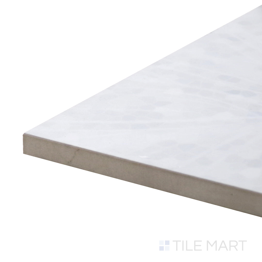 Close-up corner shot of Tele Di Marmo Revolution Thassos 24X48 Polished Porcelain Tile, featuring its crisp white tones and refined polished finish for a luxurious appearance.