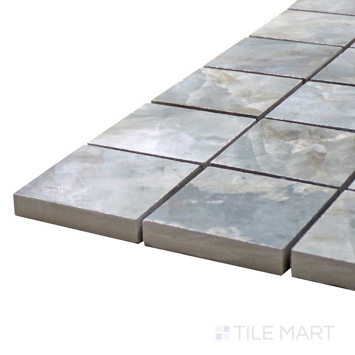 Angled close-up of Tele Di Marmo Revolution Patagonia 2" Square Matte Porcelain Mosaic, showcasing its intricate natural stone details in a sleek matte finish.