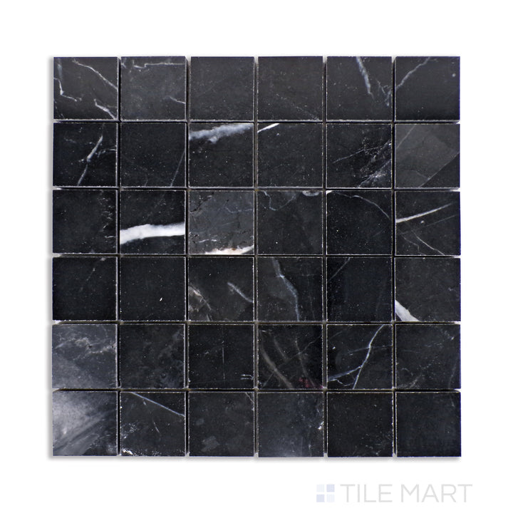 Top-down view of Tele Di Marmo Revolution Calacatta Black 2" square polished porcelain mosaic, where dramatic veining meets a lustrous surface.