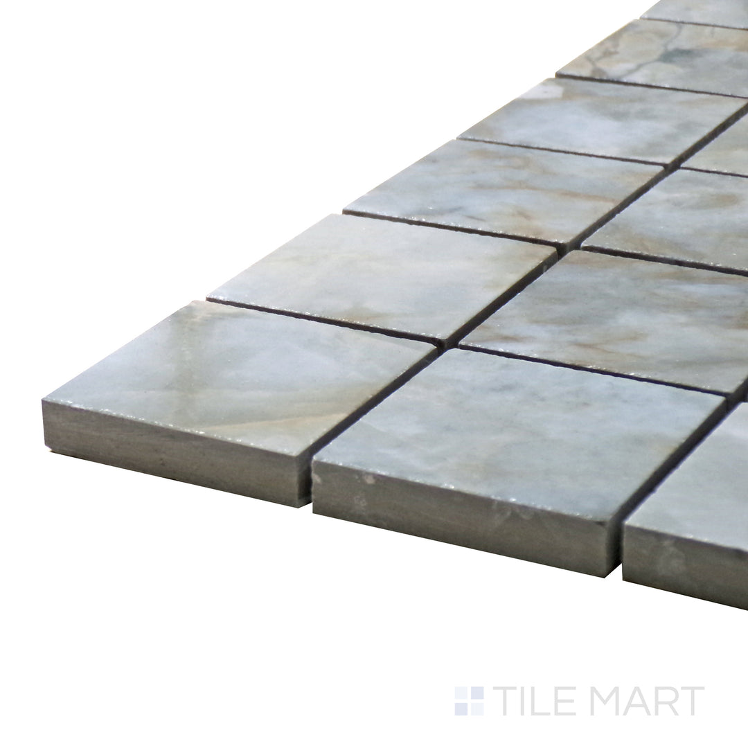 Side perspective of Tele Di Marmo Revolution Patagonia 2" Square Polished Porcelain Mosaic, capturing its unique natural stone patterns in a structured, glossy square layout.