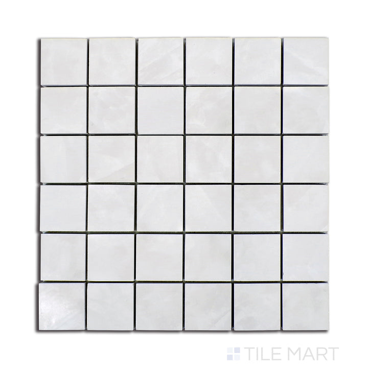 Flat-lay image of Tele Di Marmo Revolution Thassos 2" square polished porcelain mosaic, showcasing an immaculate white finish with high-gloss appeal.
