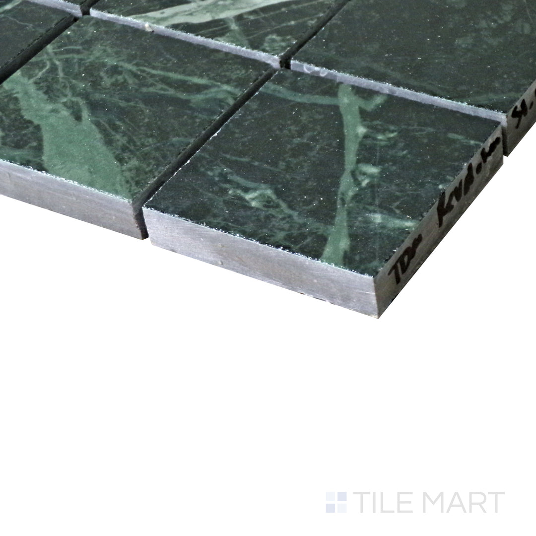 Diagonal view of Tele Di Marmo Revolution Verde St Denis 2" Square polished porcelain mosaic, highlighting its deep green hues, striking veining, and glossy polished surface.  