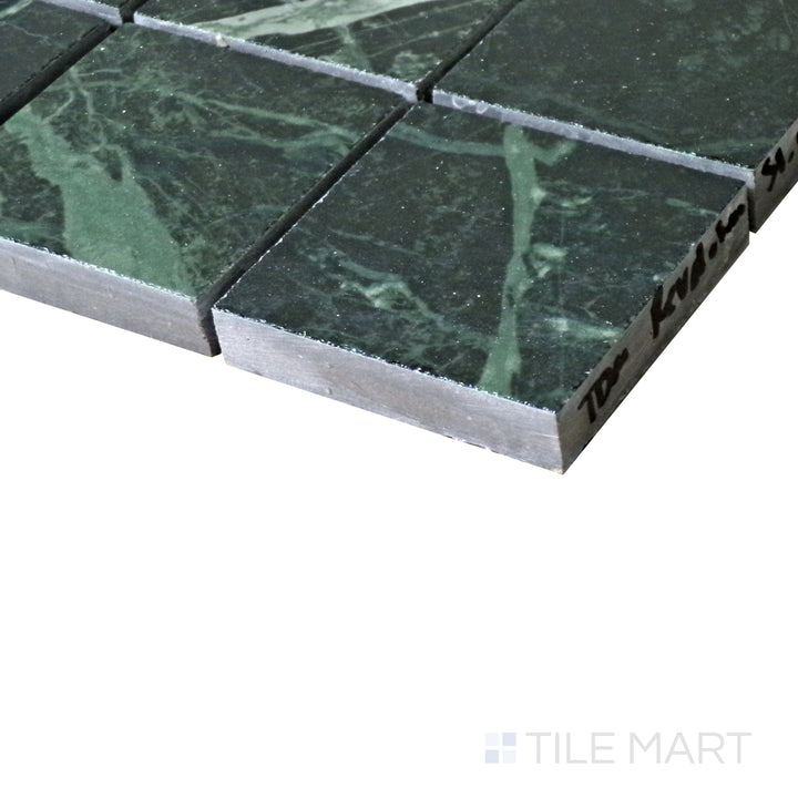 Diagonal view of Tele Di Marmo Revolution Verde St Denis 2" Square polished porcelain mosaic, highlighting its deep green hues, striking veining, and glossy polished surface.  