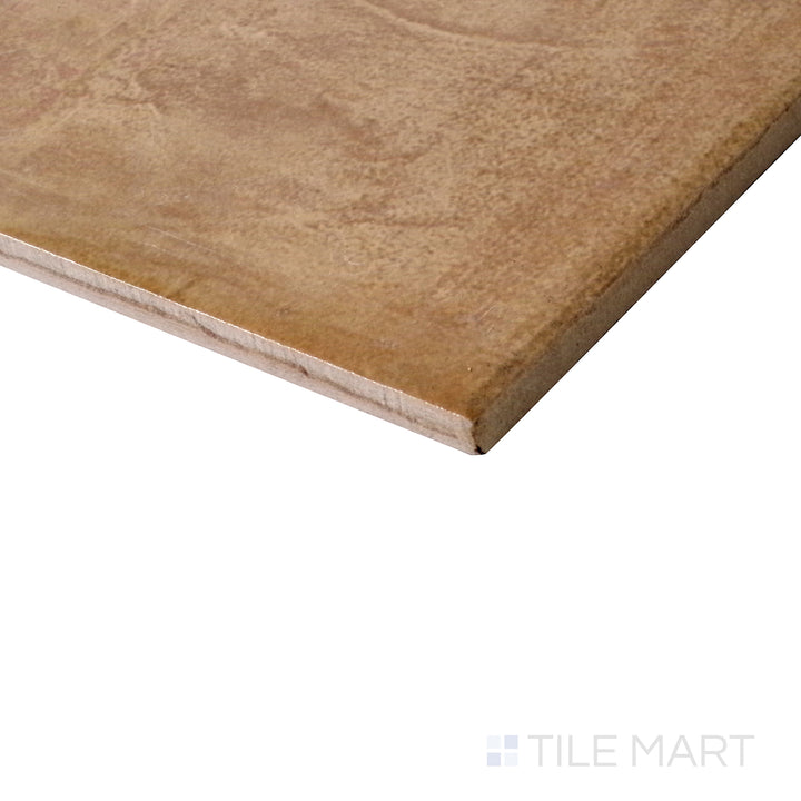 Angled shot of Terracotta Italian Saltillo Mustard 13x13 polished porcelain tile, showcasing its warm mustard tones, rustic appeal, and glossy polished surface.  
