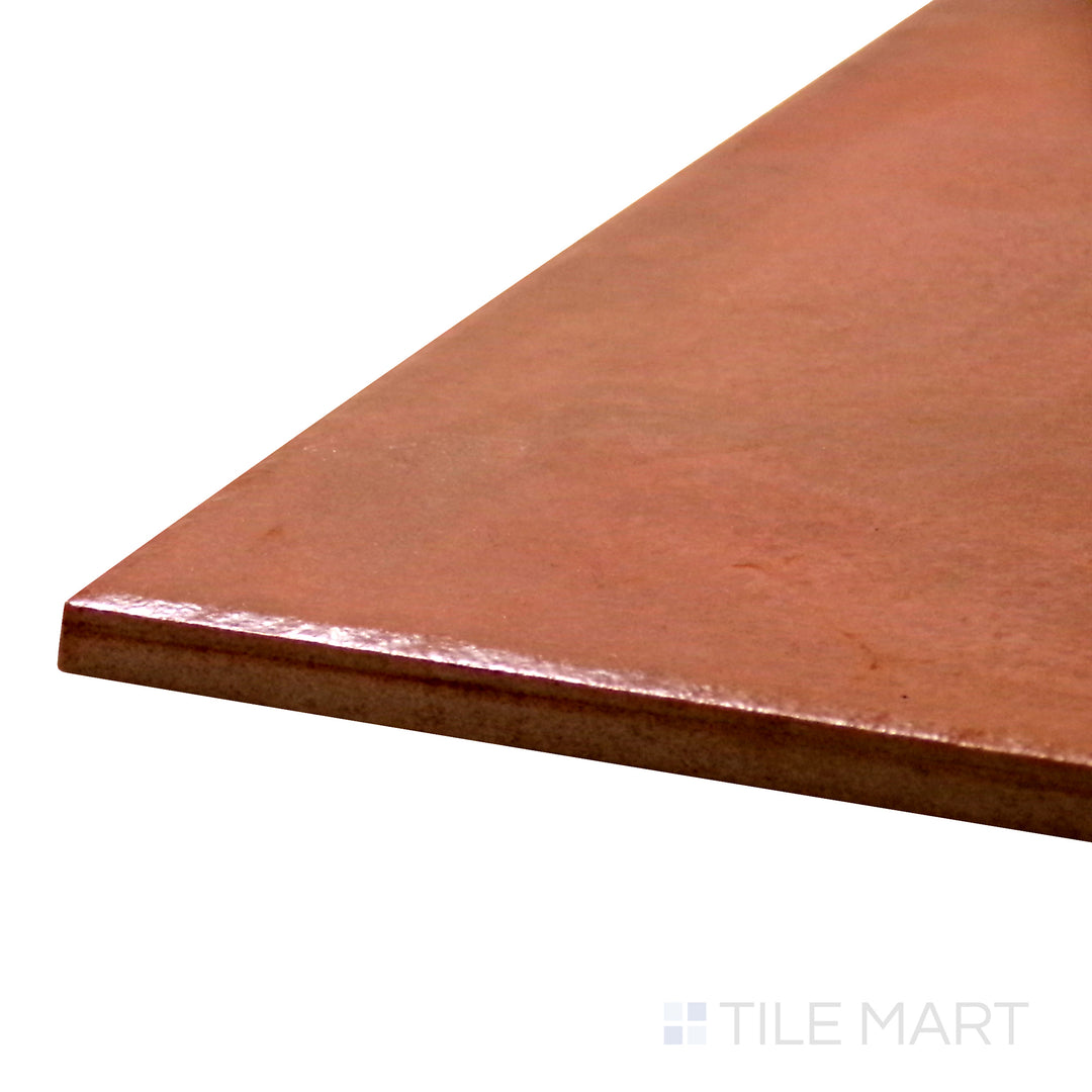 Angled view of Terracotta Italian Saltillo Terra Cotta 13X13 Polished Porcelain Tile, highlighting its rich terra cotta hues with a high-shine surface.