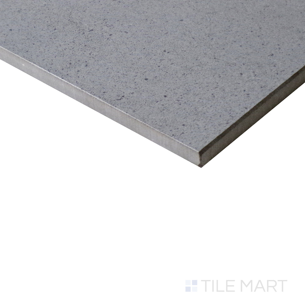 Diagonal view of Urban Living Mist Grey 12x24 matte porcelain tile, highlighting its subtle misty gray color, sleek matte surface, and urban-inspired aesthetic.  