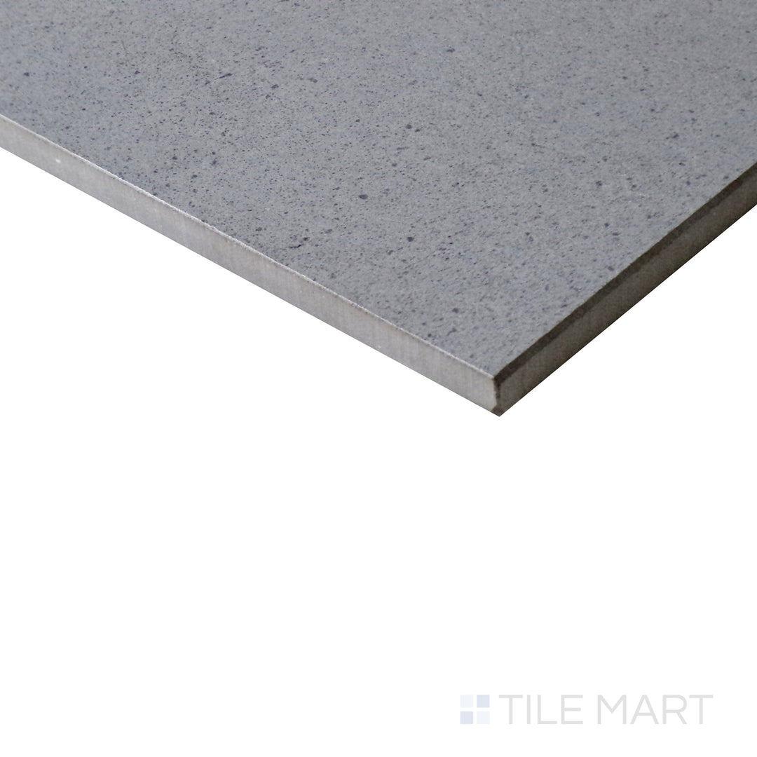 Diagonal view of Urban Living Mist Grey 12x24 matte porcelain tile, highlighting its subtle misty gray color, sleek matte surface, and urban-inspired aesthetic.  