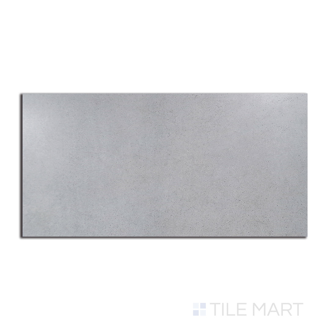 Top-down view of Urban Living Mist Grey 12X24 matte porcelain, a cool-toned surface with subtle variations for a modern and sleek look.