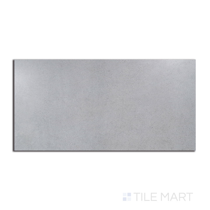 Top-down view of Urban Living Mist Grey 12X24 matte porcelain, a cool-toned surface with subtle variations for a modern and sleek look.