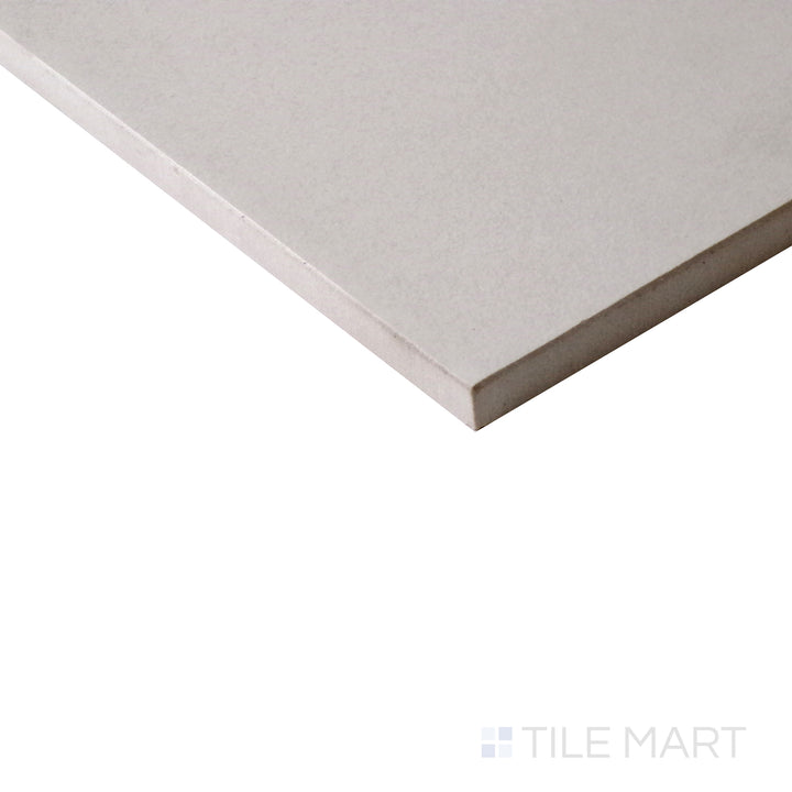 Angled shot of Urban Living Tan 12x24 matte porcelain tile, featuring warm tan hues, a natural matte finish, and a contemporary rectangular design.  