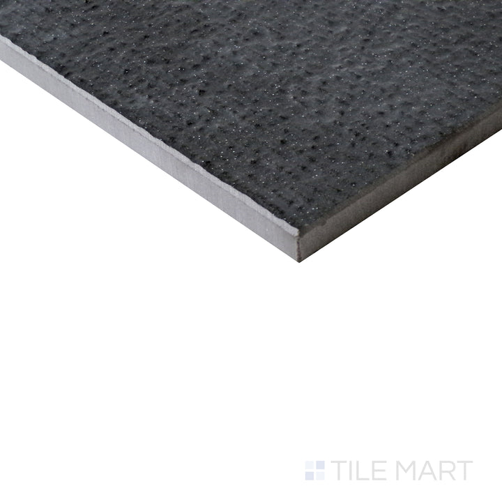 Diagonal view of Urban Living Metropolis 12x24 chiseled porcelain tile, showcasing its modern gray tones, rough-cut edges, and refined industrial aesthetic.  