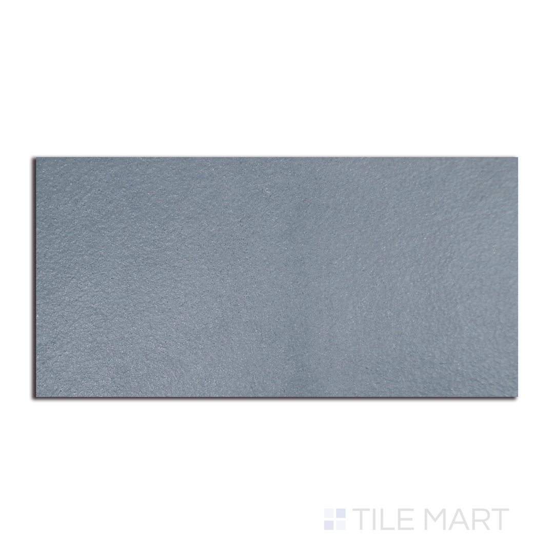 Flat-lay image of Urban Living Coastal 12X24 raw porcelain, highlighting an unfinished look that exudes an organic and natural ambiance.