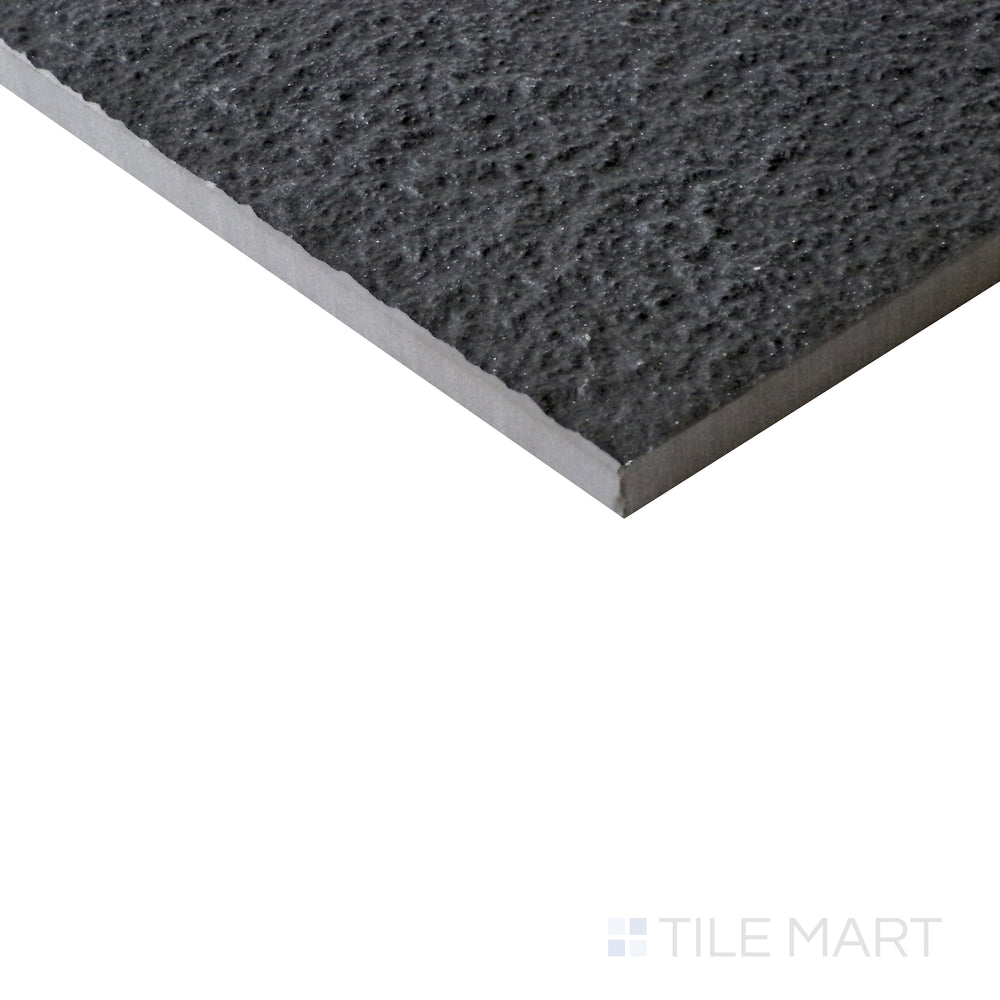 Diagonal view of Urban Living Metropolis 12x24 raw porcelain tile, highlighting its industrial gray hues, raw surface texture, and contemporary rectangular format.  