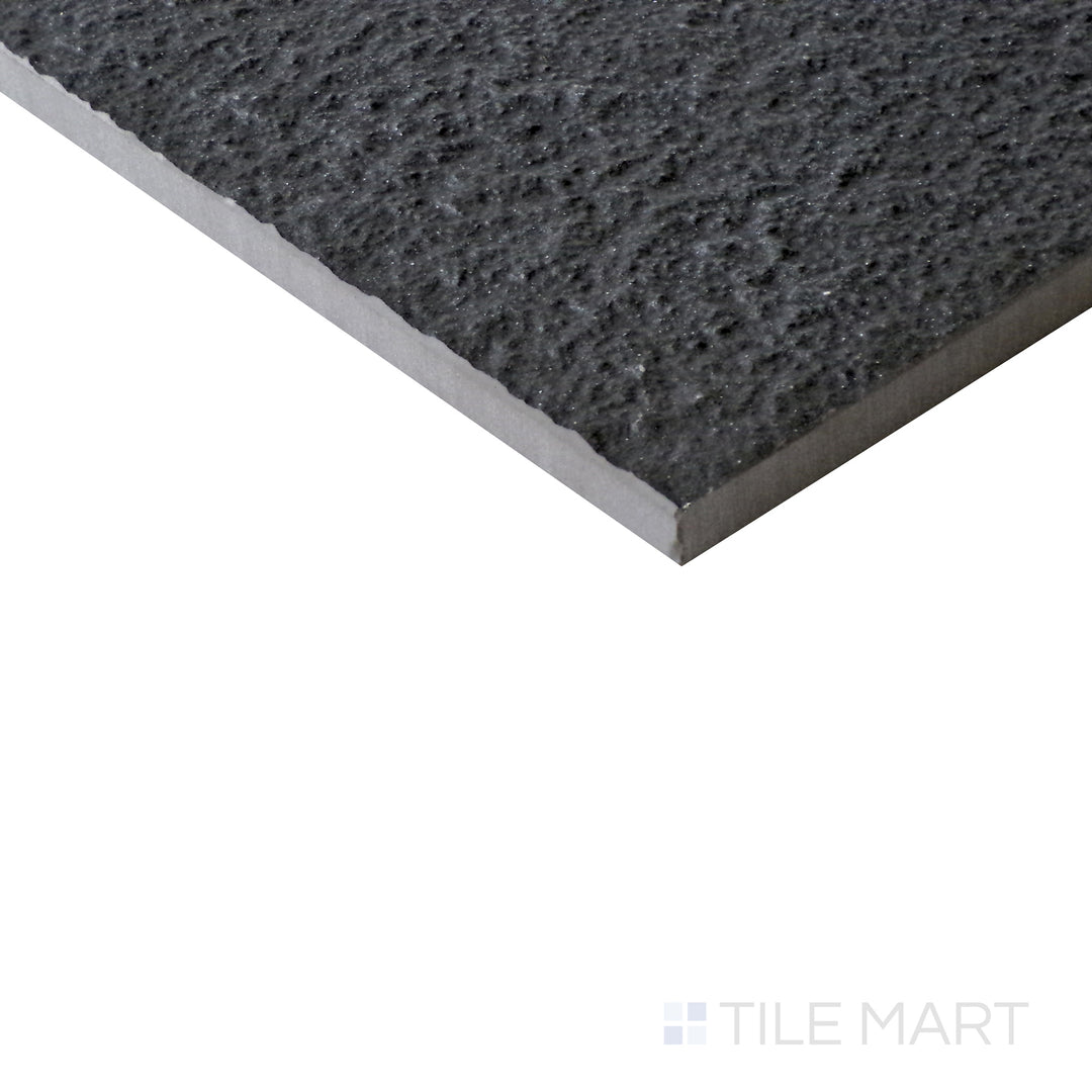 Diagonal view of Urban Living Metropolis 12x24 raw porcelain tile, highlighting its industrial gray hues, raw surface texture, and contemporary rectangular format.  