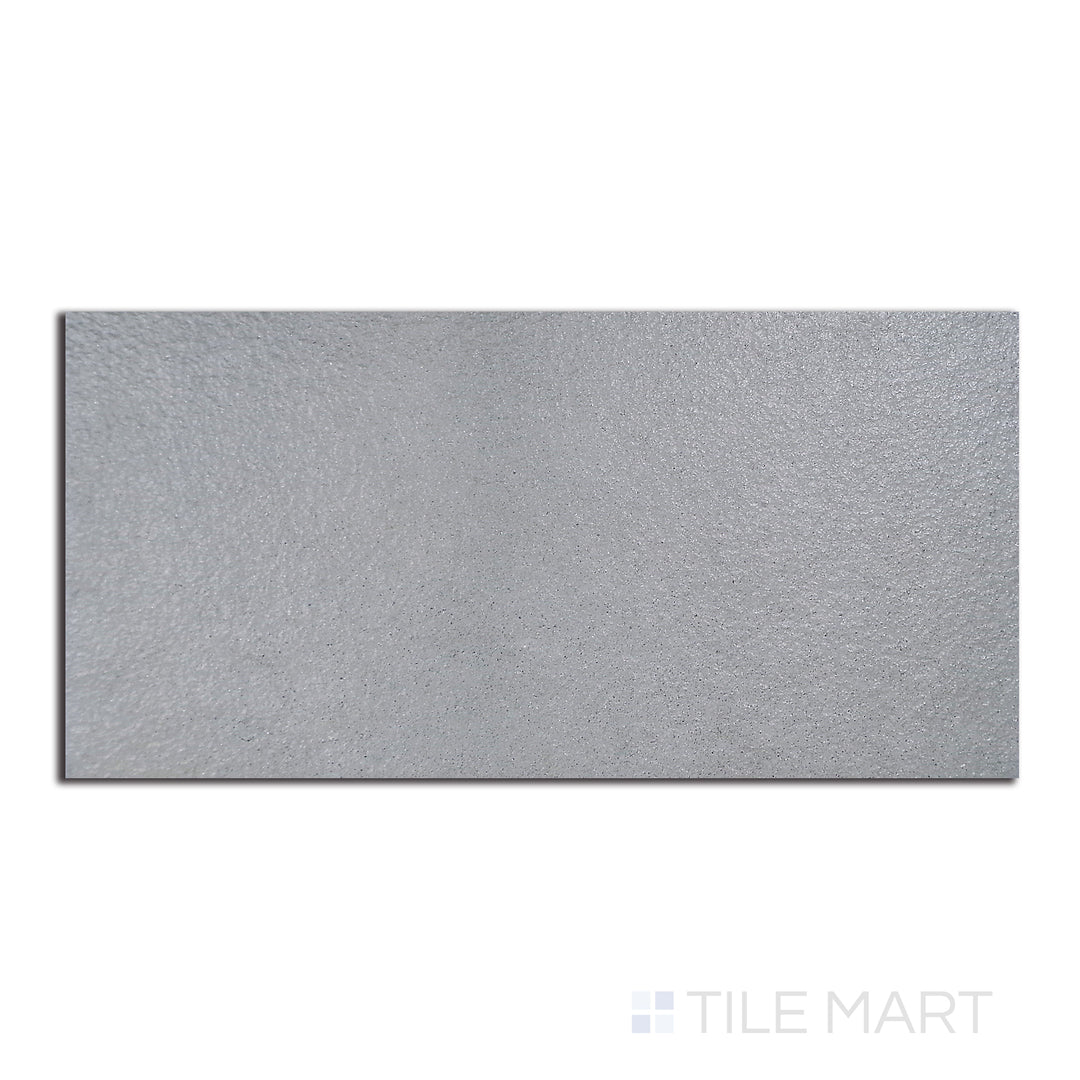 Top-down shot of Urban Living Mist Grey 12X24 Raw Porcelain, a matte grey porcelain tile with raw edges, ideal for a minimalist, modern setting.