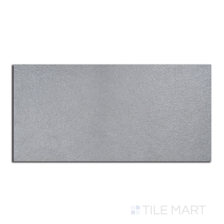 Top-down shot of Urban Living Mist Grey 12X24 Raw Porcelain, a matte grey porcelain tile with raw edges, ideal for a minimalist, modern setting.