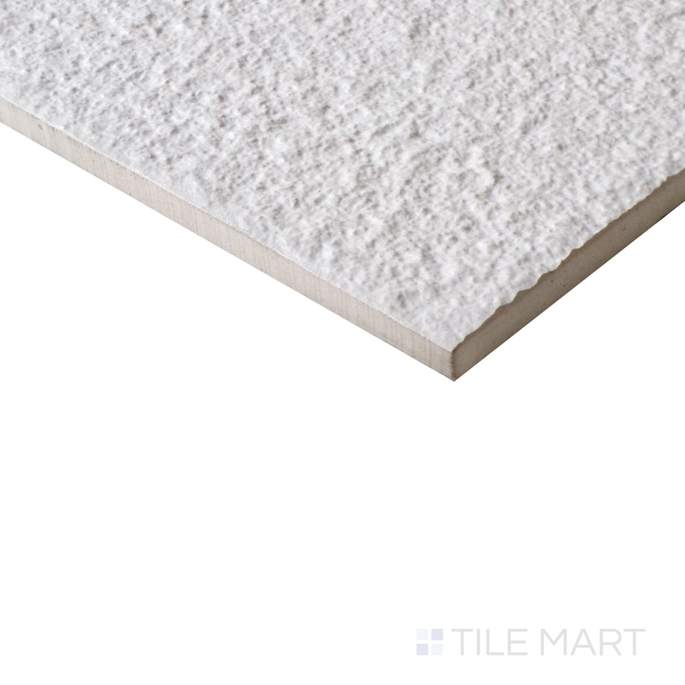 Angled view of Urban Living Pearl 12x24 raw porcelain tile, featuring a soft pearl hue, matte raw finish, and a structured rectangular shape.  