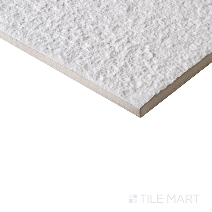 Angled view of Urban Living Pearl 12x24 raw porcelain tile, featuring a soft pearl hue, matte raw finish, and a structured rectangular shape.  