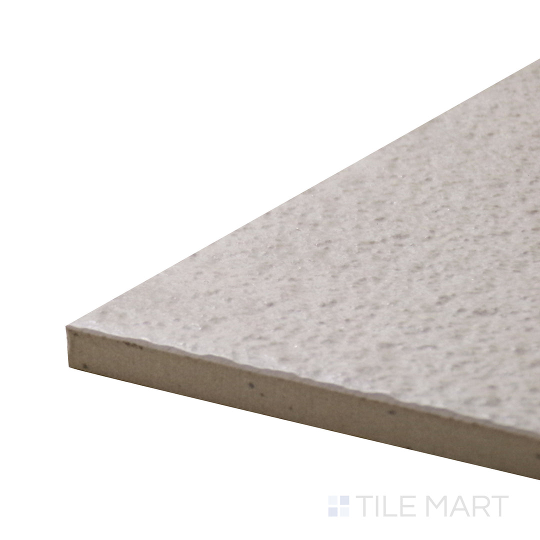 Angled close-up of Urban Living Tan 12X24 Raw Porcelain Tile, showcasing its warm earthy tones with a natural, unfinished surface.