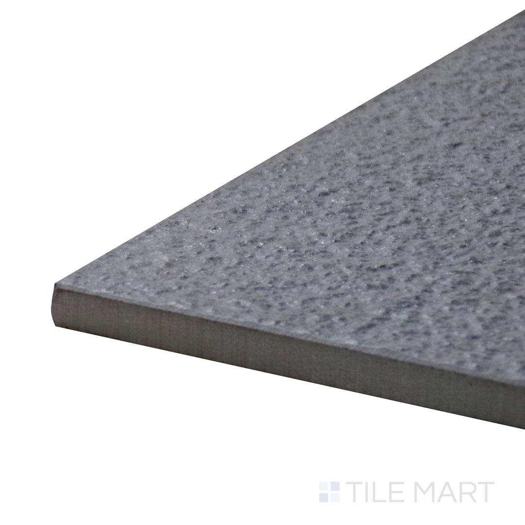 Corner-focused shot of Urban Living Titanium 12X24 Raw Porcelain Tile, featuring its industrial-inspired gray tones with an unfinished surface.