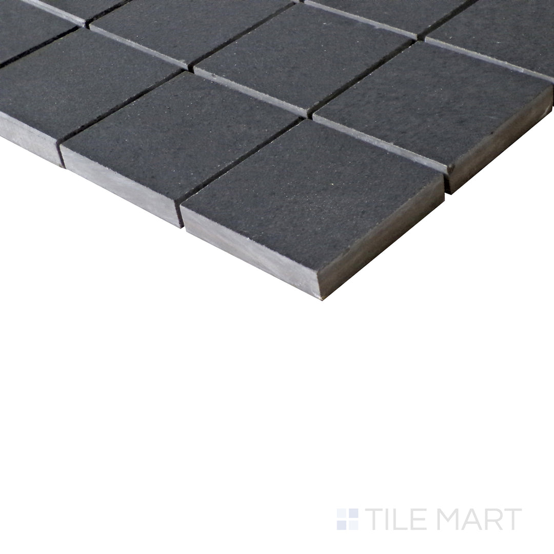 Diagonal view of Urban Living Metropolis 2" Square matte porcelain mosaic, showcasing its urban gray tones, uniform square arrangement, and contemporary matte finish.  