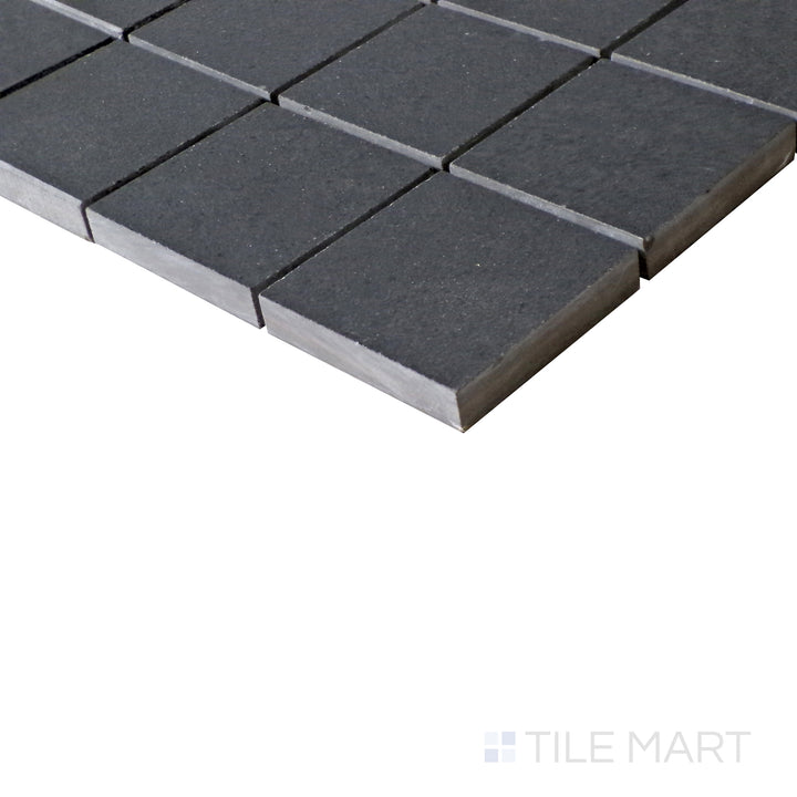 Diagonal view of Urban Living Metropolis 2" Square matte porcelain mosaic, showcasing its urban gray tones, uniform square arrangement, and contemporary matte finish.  