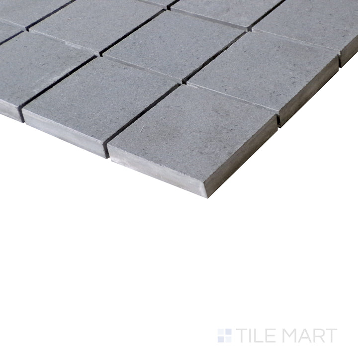 Slanted perspective of Urban Living Mist Grey 2" Square matte porcelain mosaic, emphasizing its misty gray hues, structured square pattern, and smooth matte texture.  
