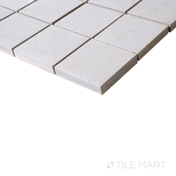 Angled view of Urban Living Pearl 2" Square matte porcelain mosaic, featuring soft pearl tones, an elegant square pattern, and a sleek matte surface.  