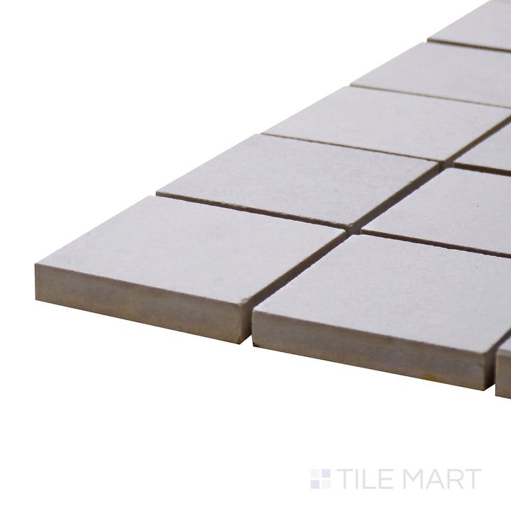 Corner angle of Urban Living Pearl 2" Square Matte Porcelain Mosaic, emphasizing its elegant pearl white hue in a modern mosaic design.
