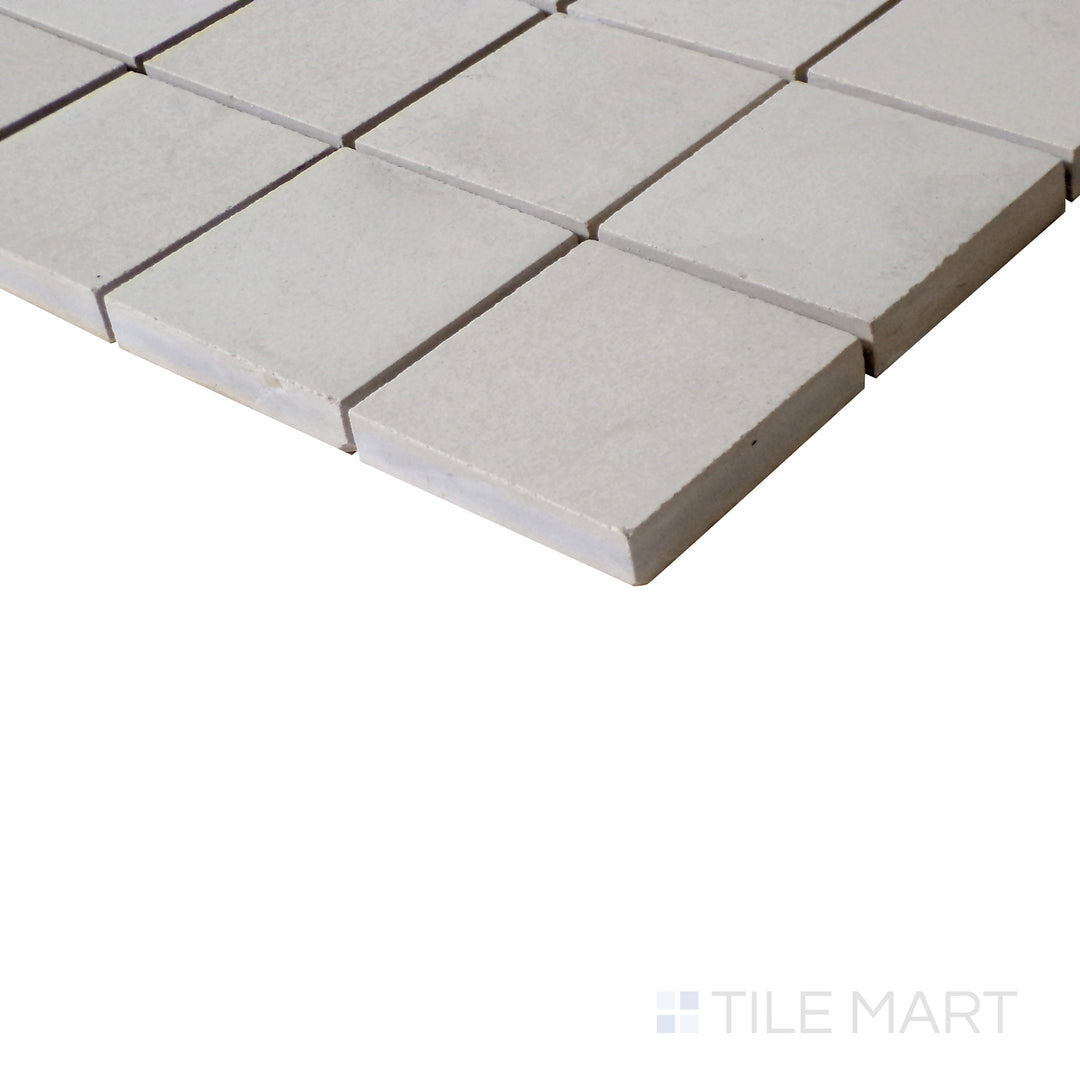 Diagonal shot of Urban Living Tan 2" Square matte porcelain mosaic, showcasing its warm tan hues, structured square layout, and subtle matte finish.  