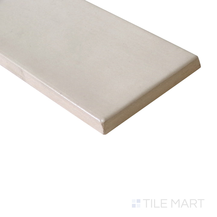 Angled shot of Village Mushroom 2.5x8 glossy ceramic tile, featuring earthy mushroom tones, sleek glossy finish, and a rectangular shape.  