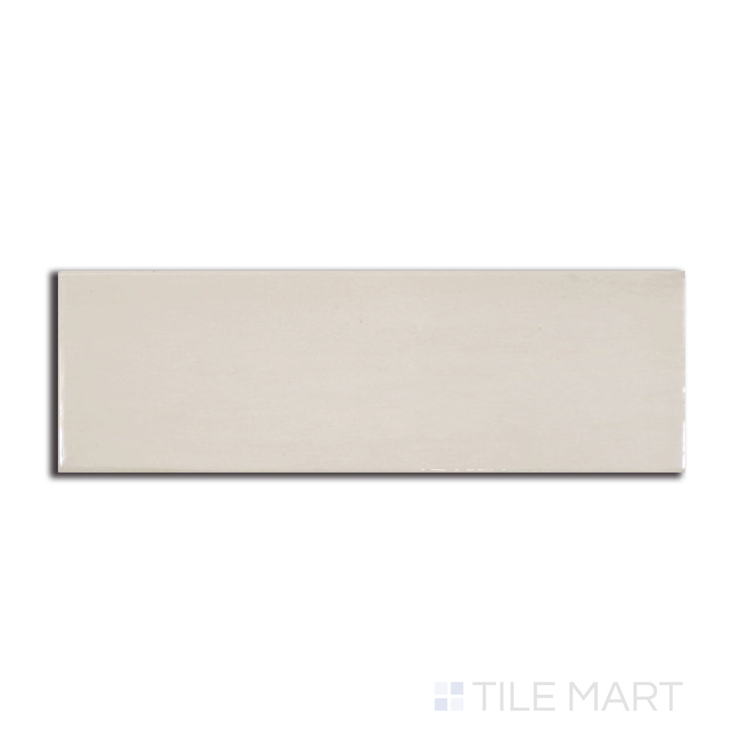 Top-down view of Village Mushroom 2.5X8 glossy ceramic tile, featuring an earthy beige tone with a lustrous sheen for a natural, warm ambiance.