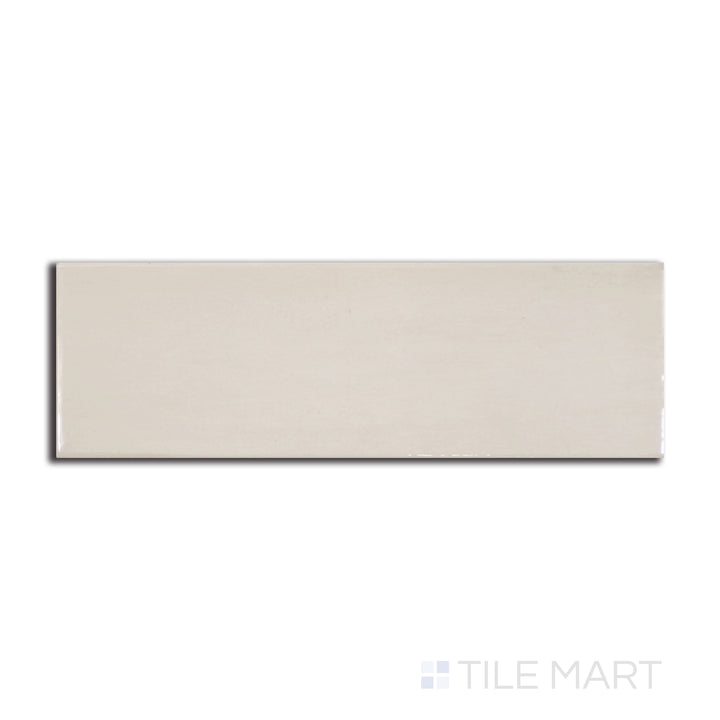 Top-down view of Village Mushroom 2.5X8 glossy ceramic tile, featuring an earthy beige tone with a lustrous sheen for a natural, warm ambiance.